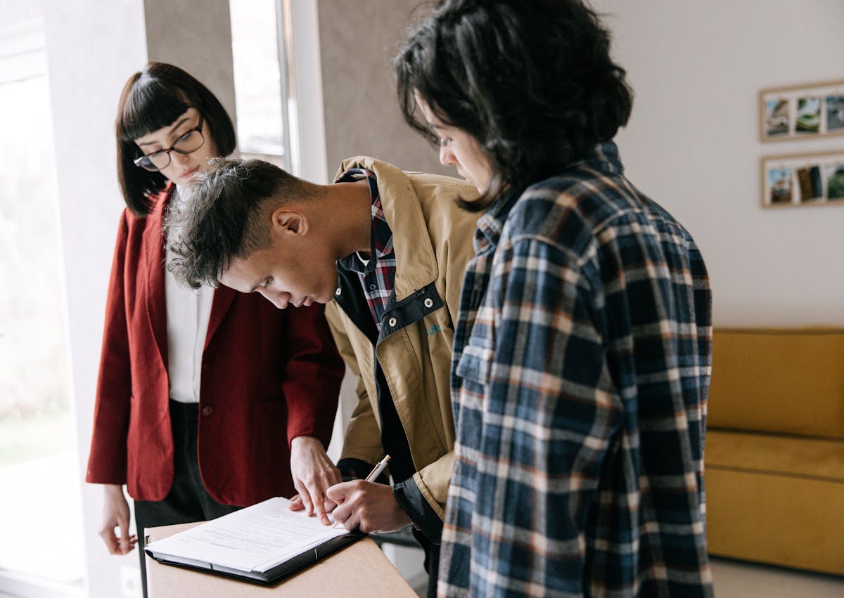 First-time buyer signing documents